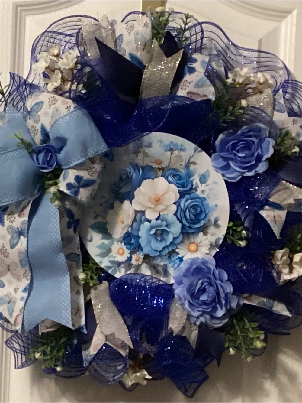 Blue Floral Decorative Wreath with Ribbon Accents